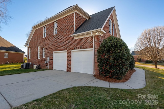 view of side of home featuring cooling unit, driveway, an attached garage, a lawn, and brick siding