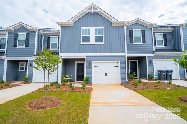 multi unit property with a garage and concrete driveway