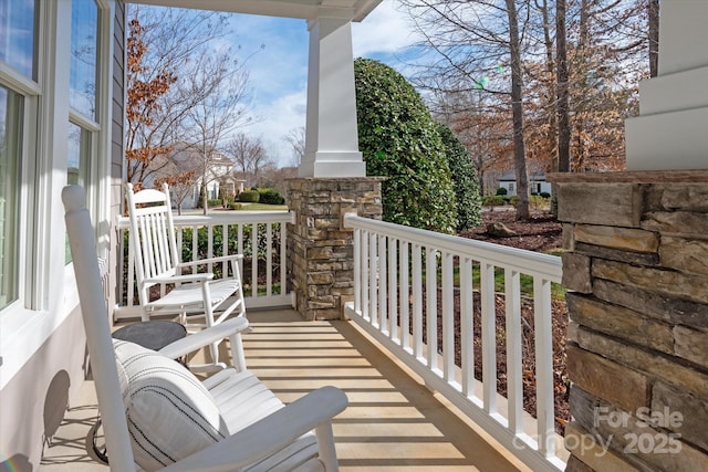 balcony featuring a porch