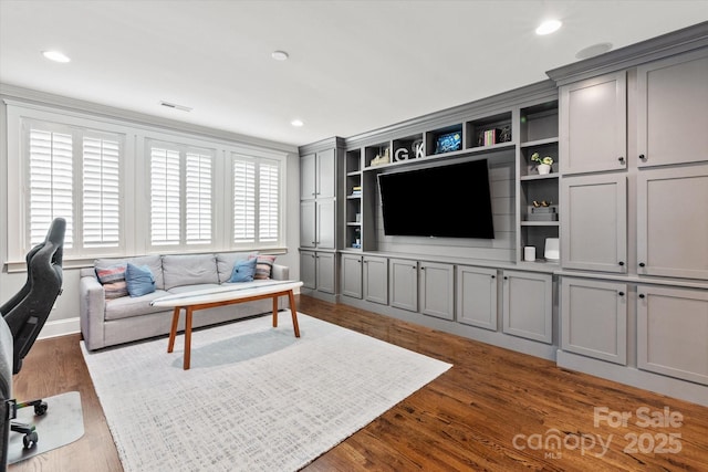 living room with dark wood-type flooring, recessed lighting, and visible vents