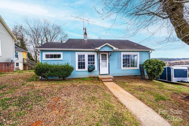 view of front of home with a front yard