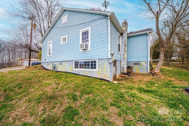 back of property featuring cooling unit, a yard, and a chimney