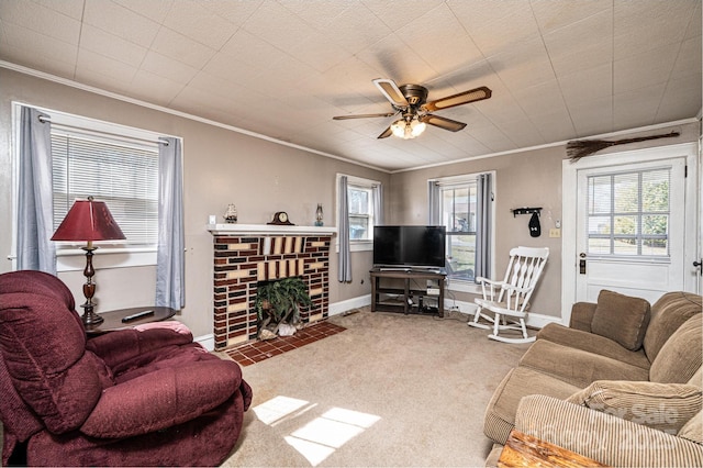 living room with ornamental molding, carpet, a wealth of natural light, and a brick fireplace