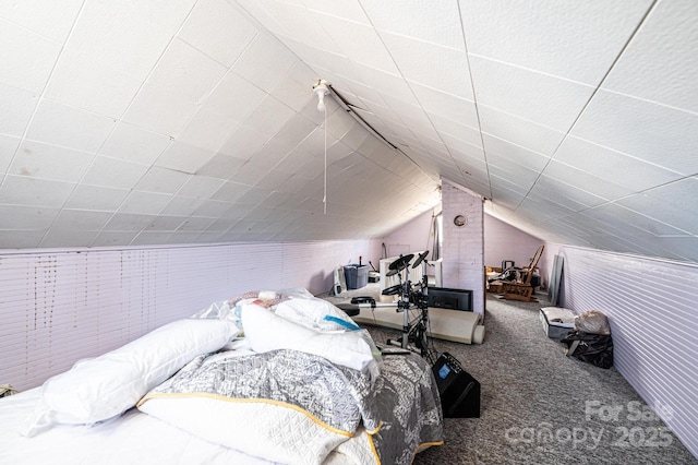 bedroom with carpet and vaulted ceiling