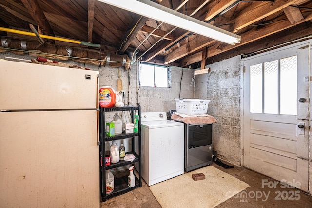 laundry room featuring laundry area and washing machine and clothes dryer