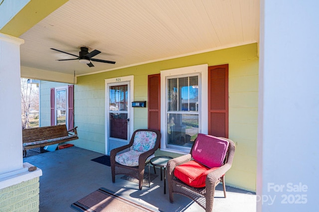 view of patio / terrace with a porch and a ceiling fan