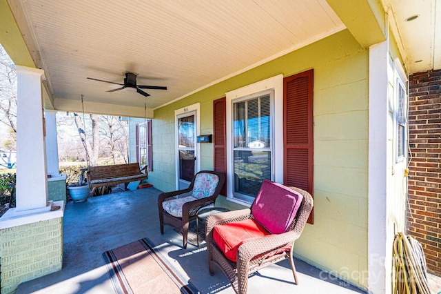 view of patio featuring covered porch and a ceiling fan