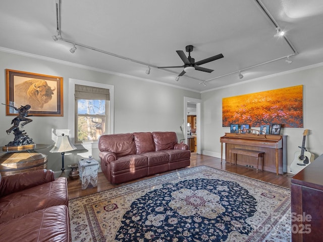 living area featuring ceiling fan, crown molding, wood finished floors, and track lighting