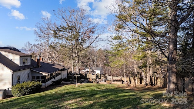 view of yard featuring a sunroom