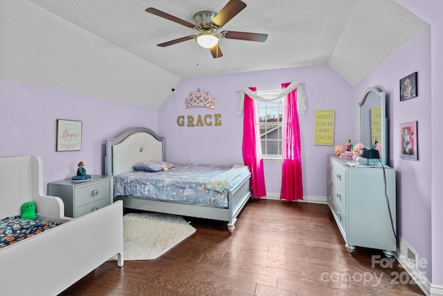 bedroom with wood-type flooring, a ceiling fan, vaulted ceiling, a textured ceiling, and baseboards