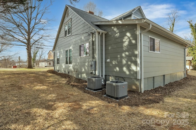 view of property exterior featuring crawl space and cooling unit