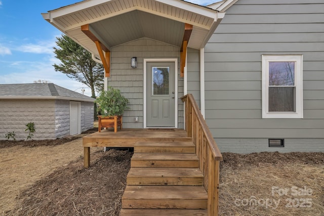 view of exterior entry with crawl space