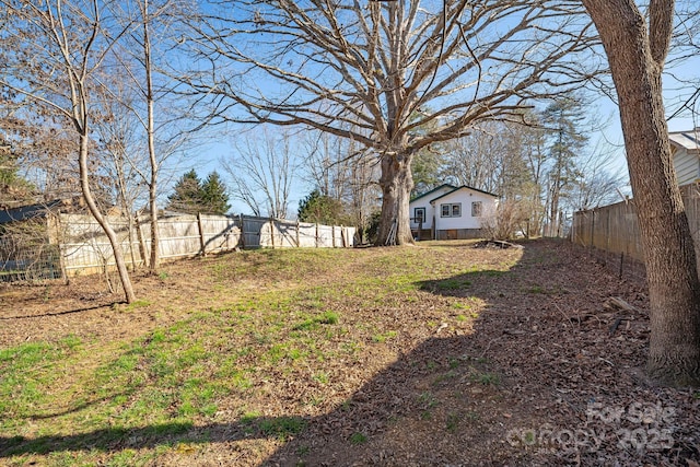 view of yard with a fenced backyard