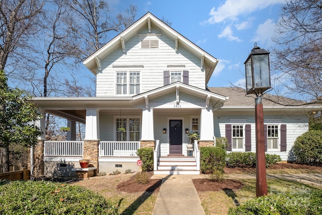 view of front of house featuring covered porch and crawl space