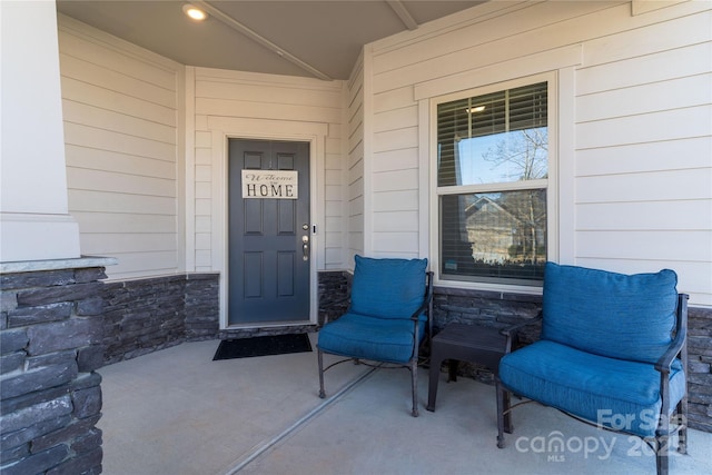 entrance to property with stone siding