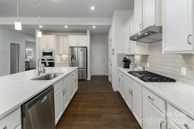 kitchen featuring stainless steel appliances, white cabinetry, a sink, and under cabinet range hood