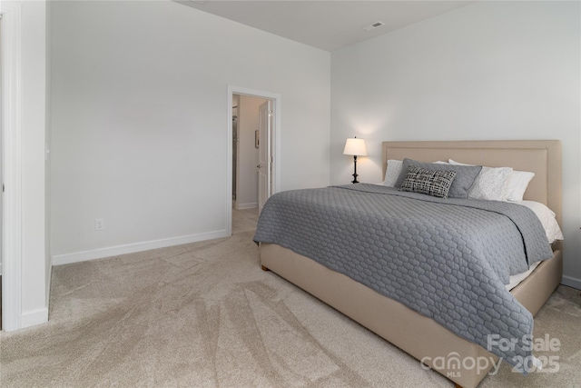 bedroom with baseboards, visible vents, and carpet flooring