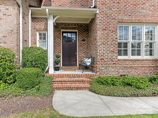 entrance to property with brick siding