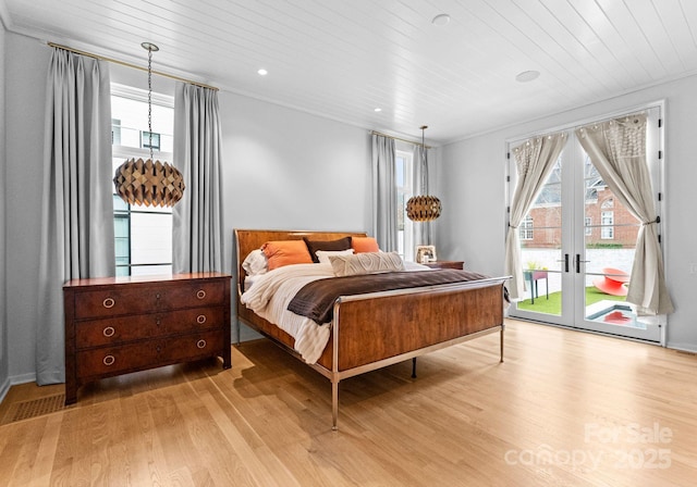 bedroom featuring recessed lighting, wood finished floors, wooden ceiling, and access to outside