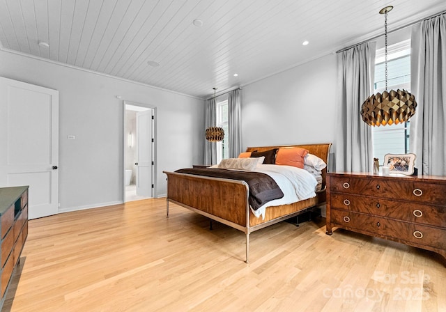 bedroom with wood ceiling, light wood-style flooring, and crown molding