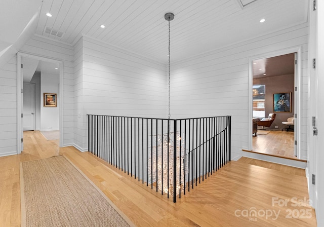 hallway with recessed lighting and wood finished floors