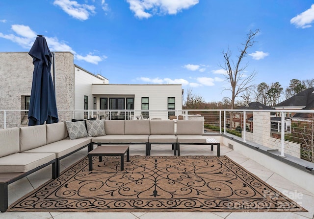 exterior space with an outdoor living space and a balcony