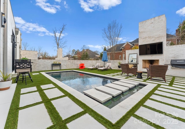 view of pool featuring a patio area, area for grilling, an outdoor living space with a fireplace, and a fenced backyard