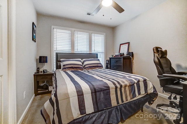 bedroom with visible vents, baseboards, carpet, and a ceiling fan