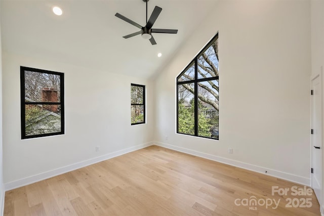 unfurnished room with baseboards, recessed lighting, and light wood-style floors