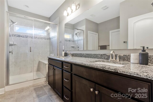 2934 Hiddenbrook Way, Fort Mill, SC 29707 - full bath with a sink, visible vents, double vanity, and a shower stall