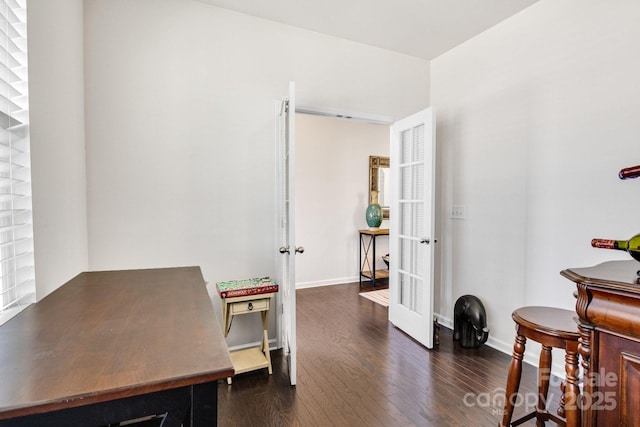 office space with french doors, wood finished floors, and baseboards