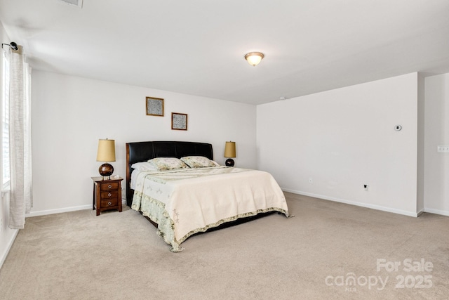 bedroom featuring carpet flooring and baseboards