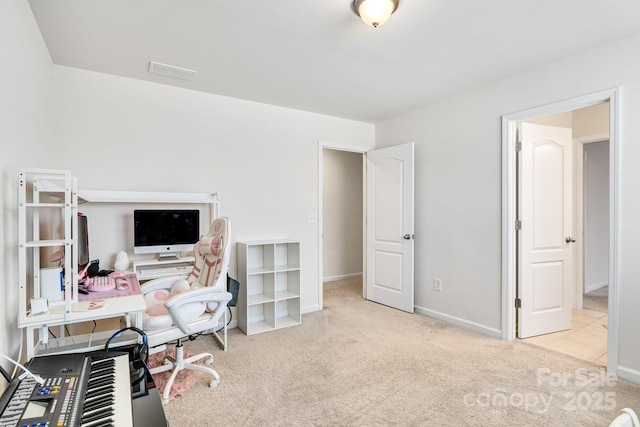 carpeted home office with baseboards and visible vents