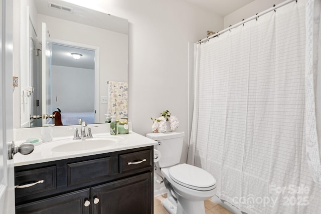 full bath with visible vents, a shower with shower curtain, toilet, vanity, and tile patterned floors