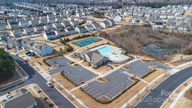 birds eye view of property with a residential view