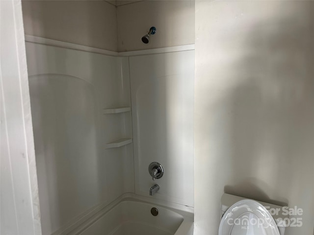 full bathroom featuring shower / tub combination and toilet