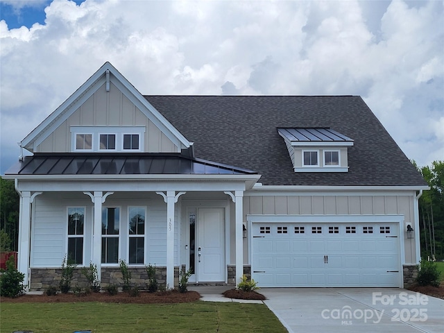 305 Basil Dr, Indian Trail, NC 28079 - view of front of home featuring board and batten siding, roof with shingles, and stone siding