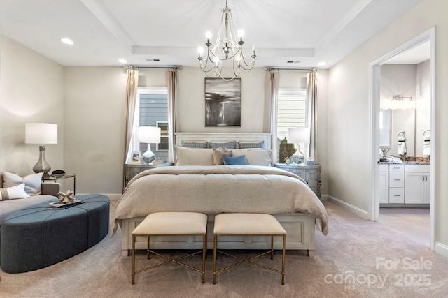 305 Basil Dr, Indian Trail, NC 28079 - bedroom featuring a chandelier, light colored carpet, recessed lighting, ensuite bathroom, and a tray ceiling