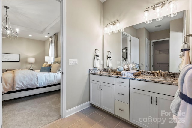 305 Basil Dr, Indian Trail, NC 28079 - ensuite bathroom featuring double vanity, tile patterned flooring, and recessed lighting