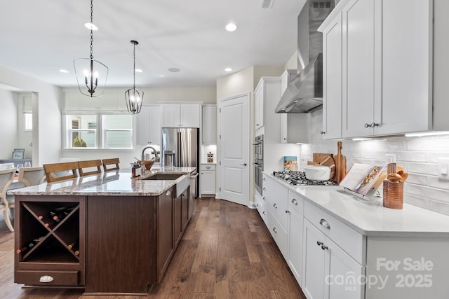 305 Basil Dr, Indian Trail, NC 28079 - kitchen with open shelves, wall chimney exhaust hood, tasteful backsplash, dark wood-style floors, and recessed lighting