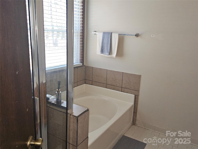 2630 Sloan Dr, Charlotte, NC 28208 - full bathroom with tile patterned flooring and a garden tub