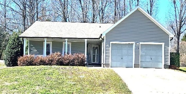 2630 Sloan Dr, Charlotte, NC 28208 - single story home with an attached garage, driveway, and a front lawn