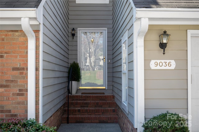 property entrance with brick siding