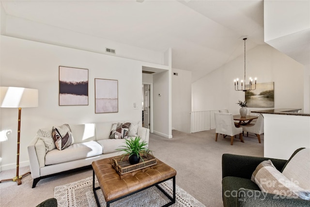 carpeted living area featuring visible vents, vaulted ceiling, and an inviting chandelier