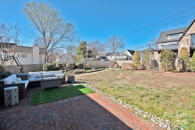 view of yard featuring a patio area, a fenced backyard, a residential view, and an outdoor hangout area