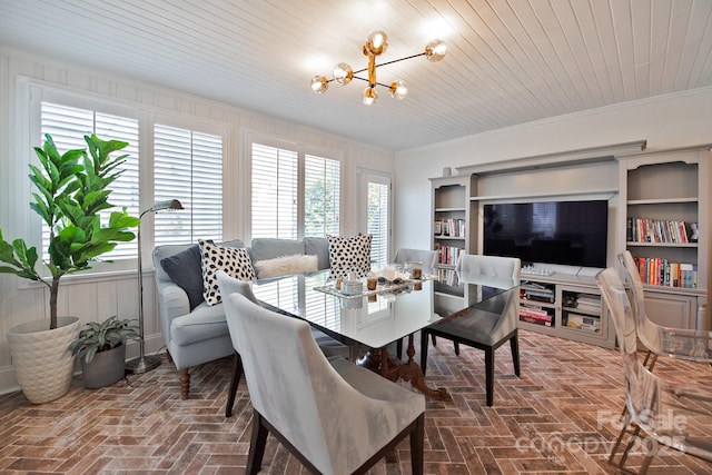 dining space with ornamental molding, brick floor, wooden ceiling, and a notable chandelier