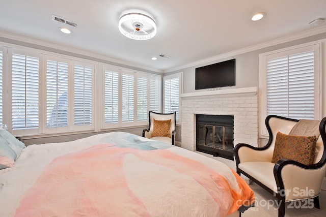 bedroom featuring ornamental molding, recessed lighting, visible vents, and a fireplace