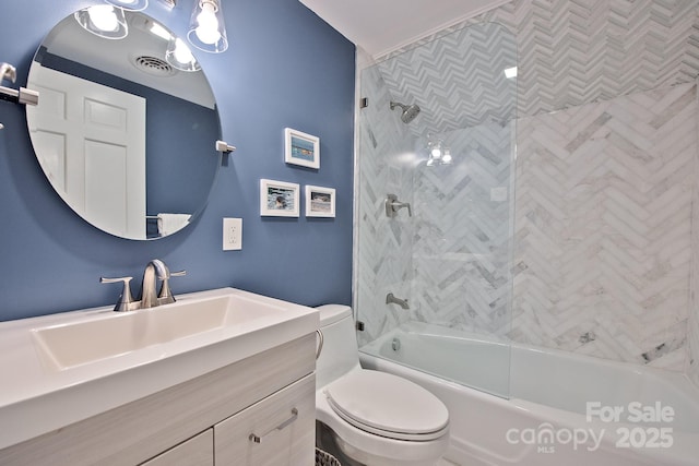 full bathroom with washtub / shower combination, visible vents, vanity, and toilet