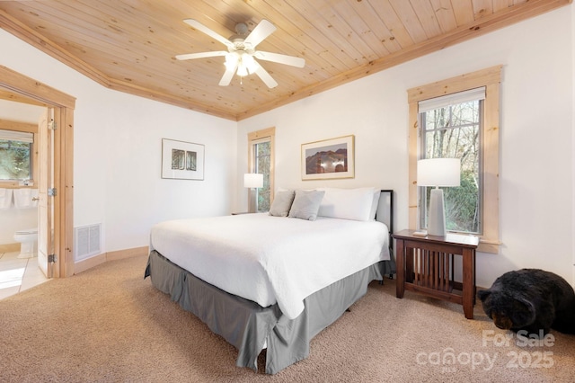 bedroom featuring baseboards, visible vents, wood ceiling, ornamental molding, and carpet flooring