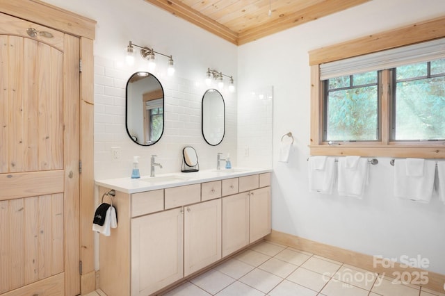 full bath with double vanity, tasteful backsplash, a sink, tile patterned flooring, and wooden ceiling